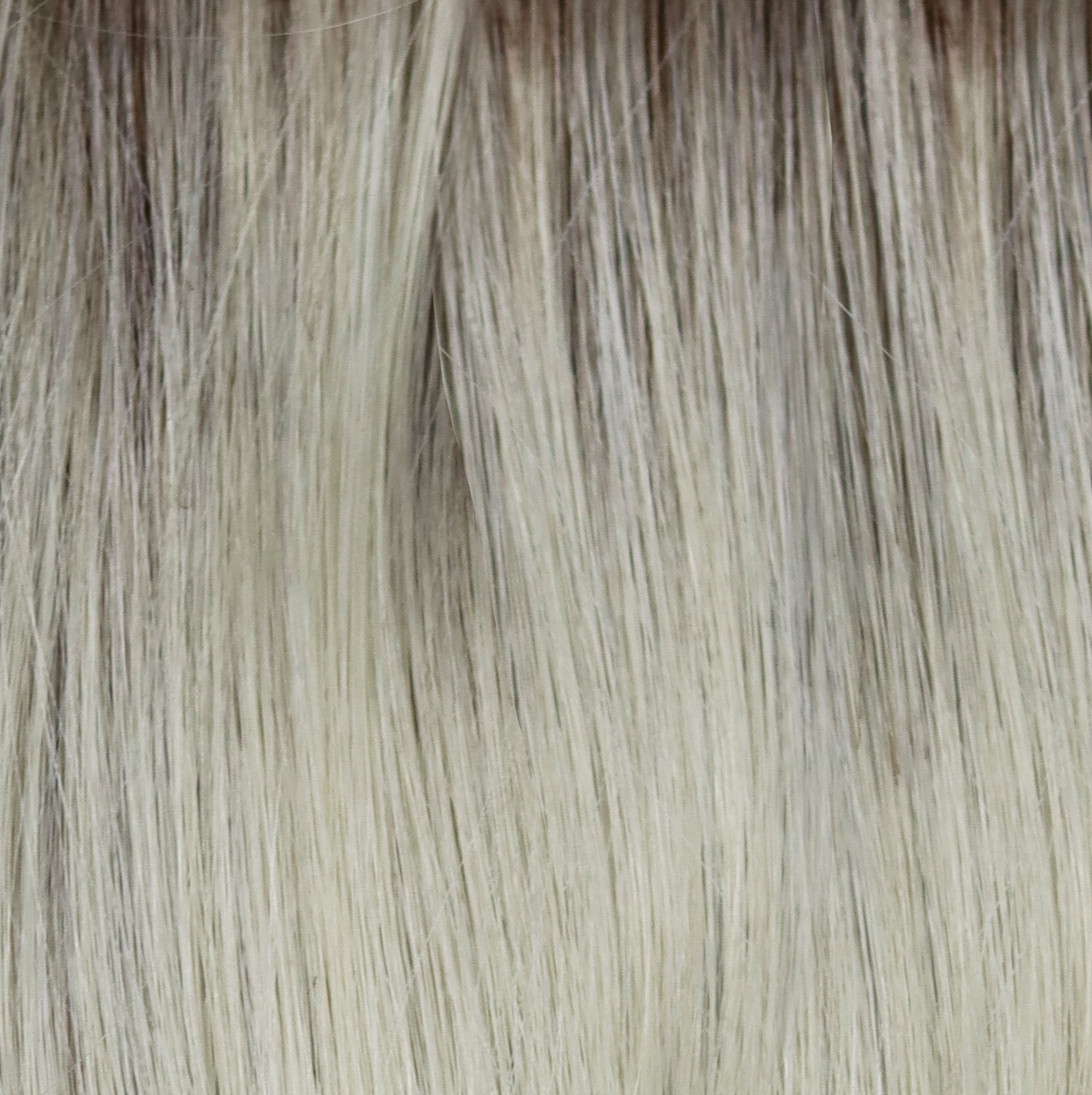 Creamy Dolce - A beautiful blond with a natural regrowth of a dark to medium honey brown with a whole host of tiny weaves of orchid white blonds and pale creams.