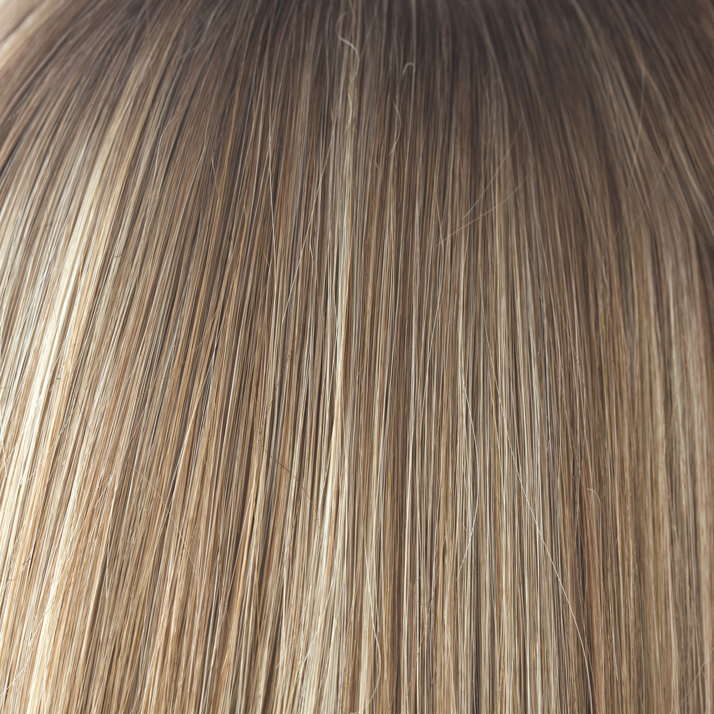 Spring Honey-R - A natural and the root tone is a medium gold honey brown. There is a mix of white blonde highlights and strawberry blonds. Complemented with medium velvet brown undertones.