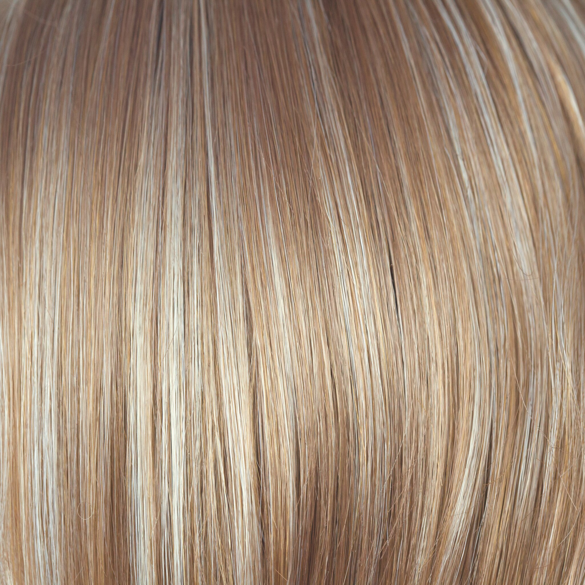 Chai Cream  -  A light blonde color packed full of slices of golden ivory, very light pearl blonds offset with butterscotch beiges that lift your face. A beautiful complementary shade of blond.