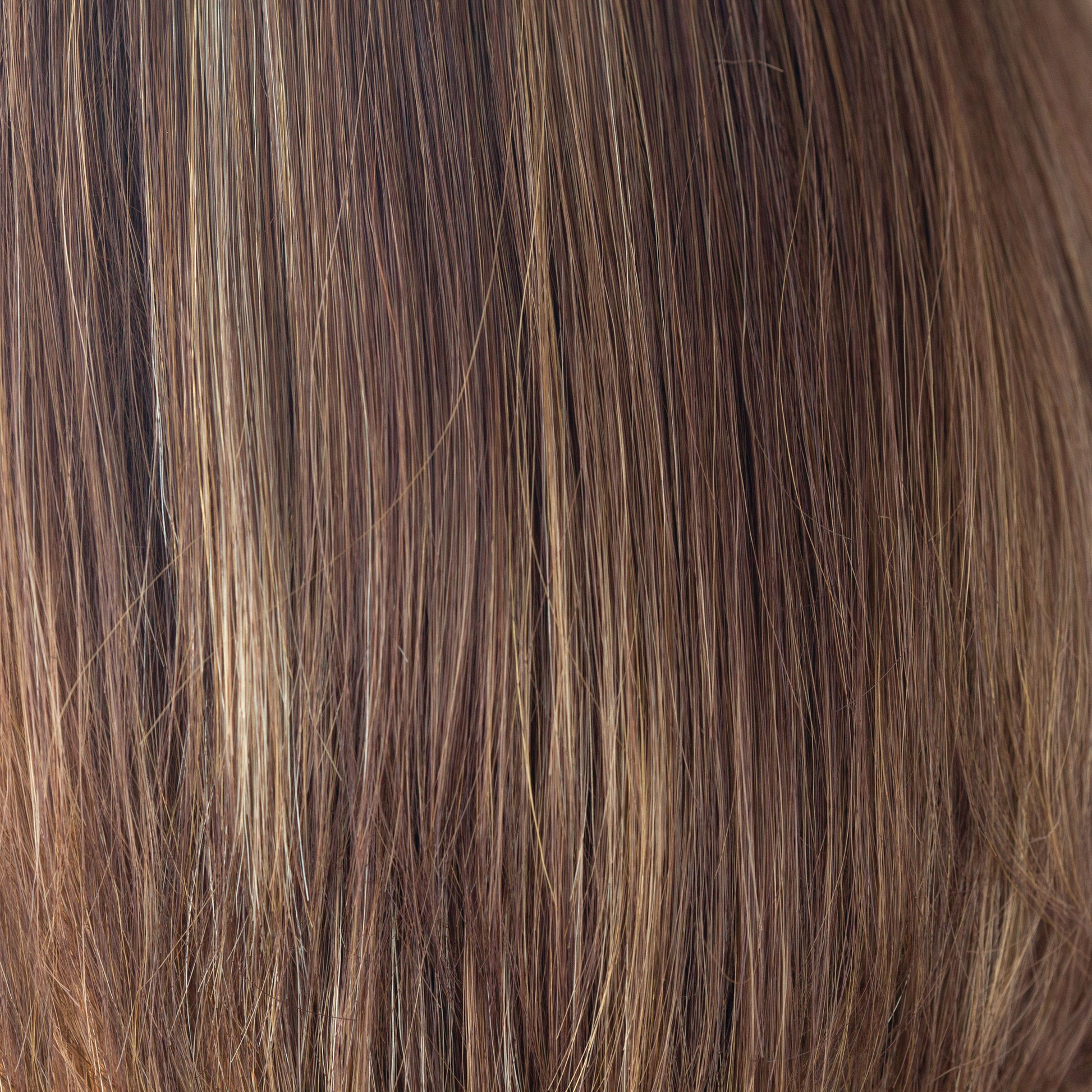 Coconut Spice  -  This medium red copper brown has a tasteful blend of lighter red and dark blonds. Coconut Spice has twists of pale coconut blonde shades throughout, spicing up this spectacular color. This continues to be a popular choice world over.