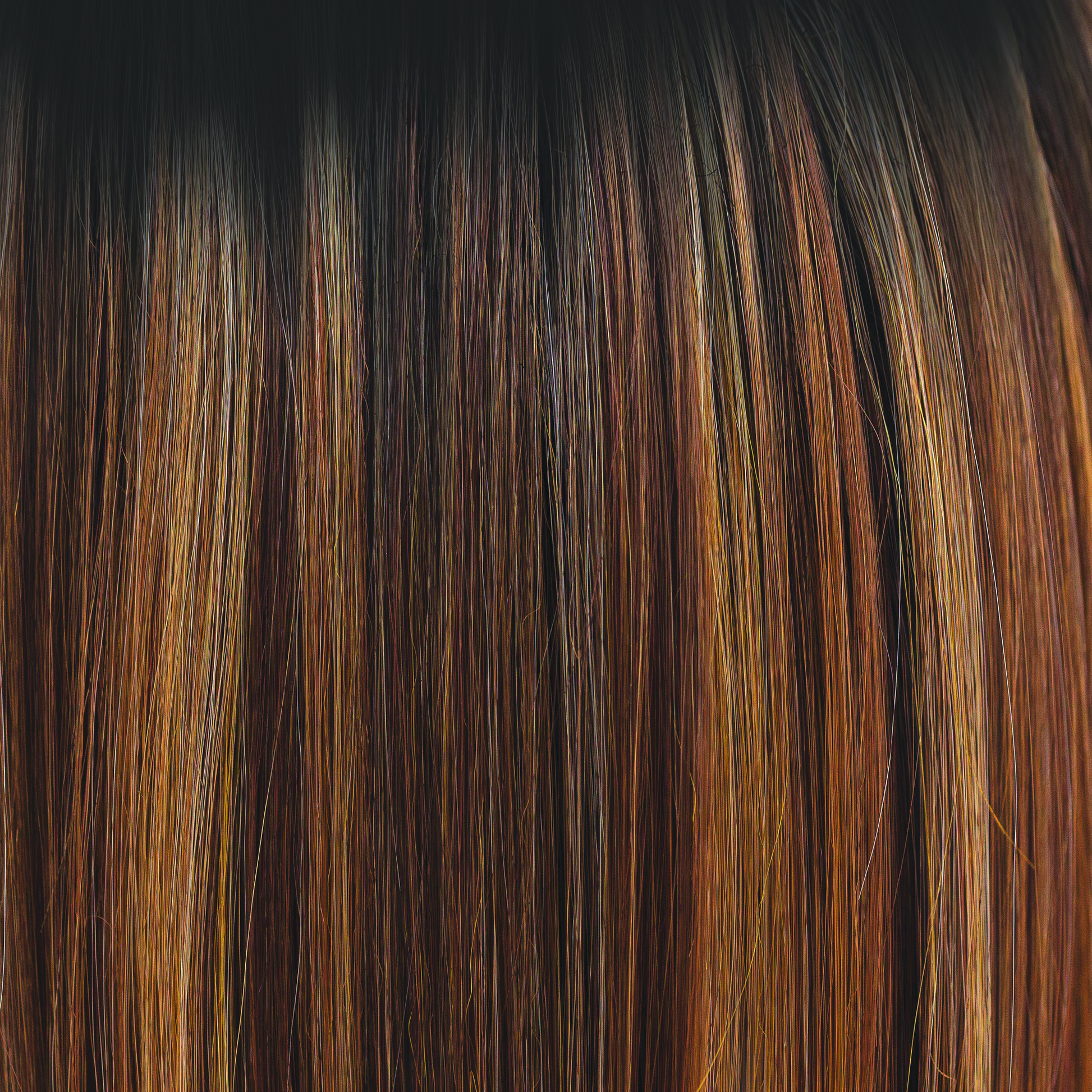 Molten Amber  -  A dark brown rooted color blending into chestnut and deep copper tones, with flecks of creamy golden fine blonds. Simply stunning and very wearable. Molten Amber oozes class and is a high heat color.