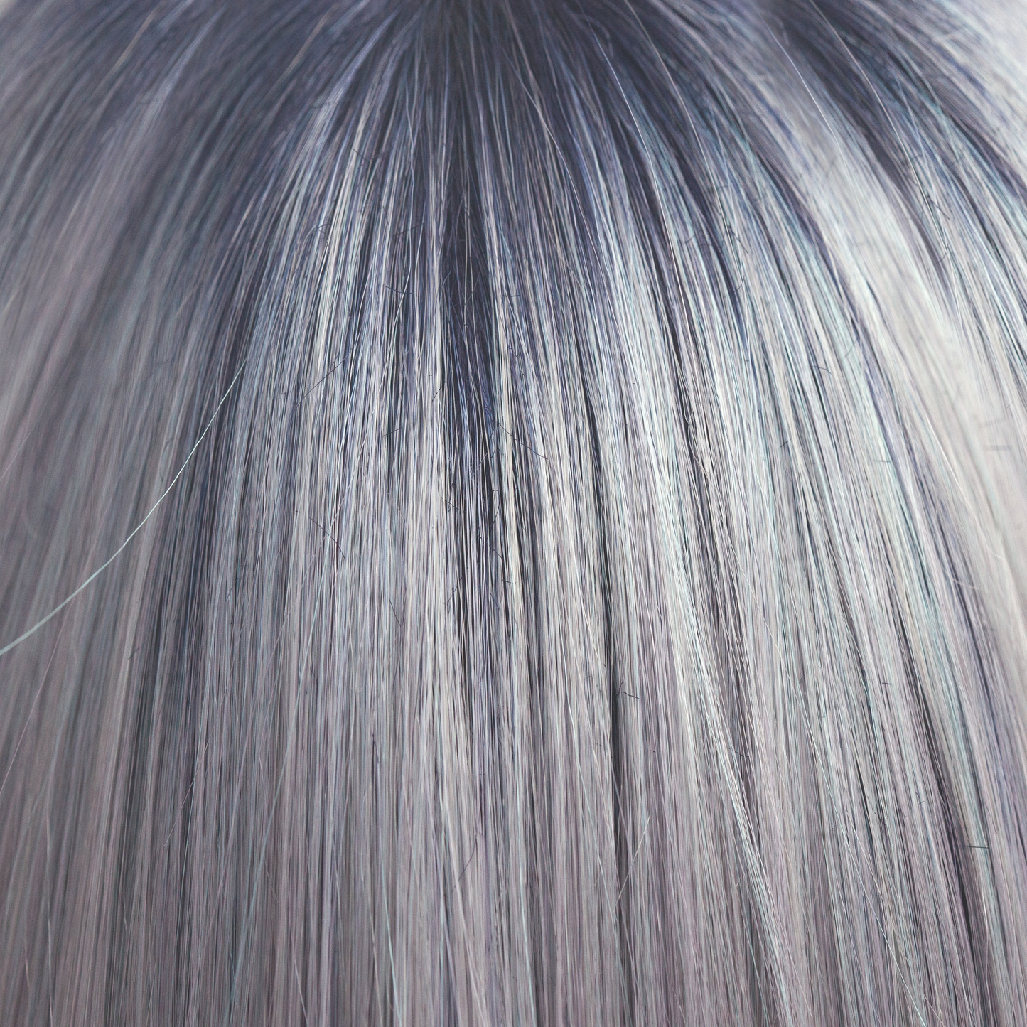 Pastel Blue-R  -  A cool pale pastel blue with hues of white. This Pastel Blue-R color has the palest of mineral blue highlights and silver shadows graduating from a dark blue sapphire root giving depth and definition.
